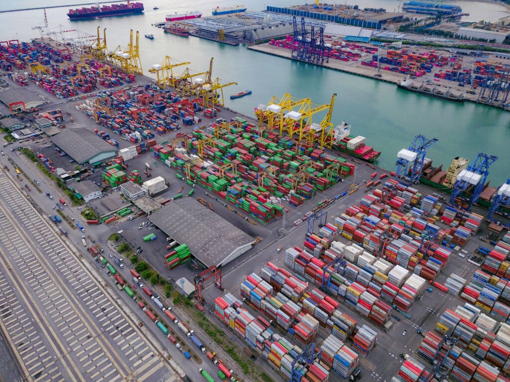 CARM - Aerial top view of container cargo ship in the export and import business and logistics international goods in urban city Shipping to the harbor by crane in Laem Chabang Chon Buri Thailand