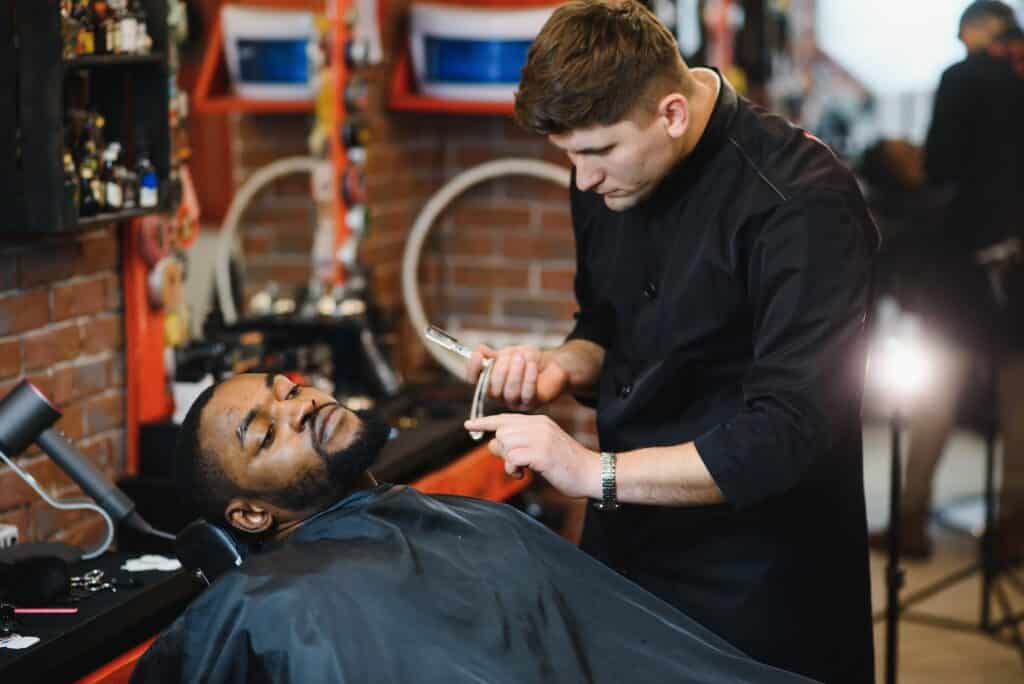Young African american man visiting barbershop